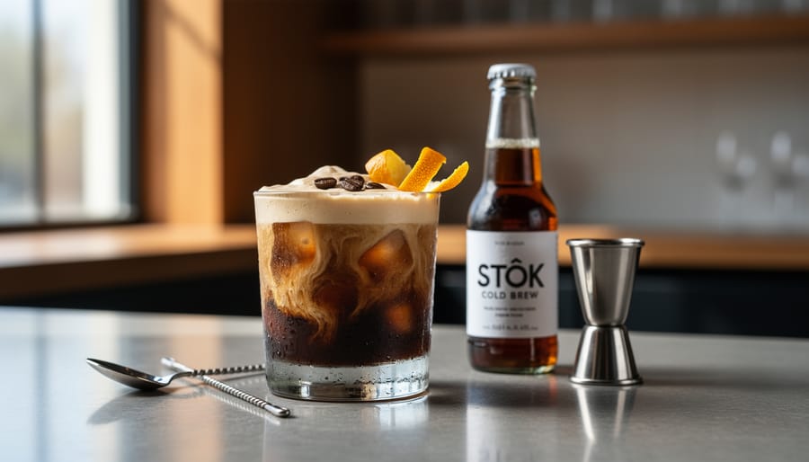 Close-up of a creamy cold brew coffee cocktail with foam in a frosted glass